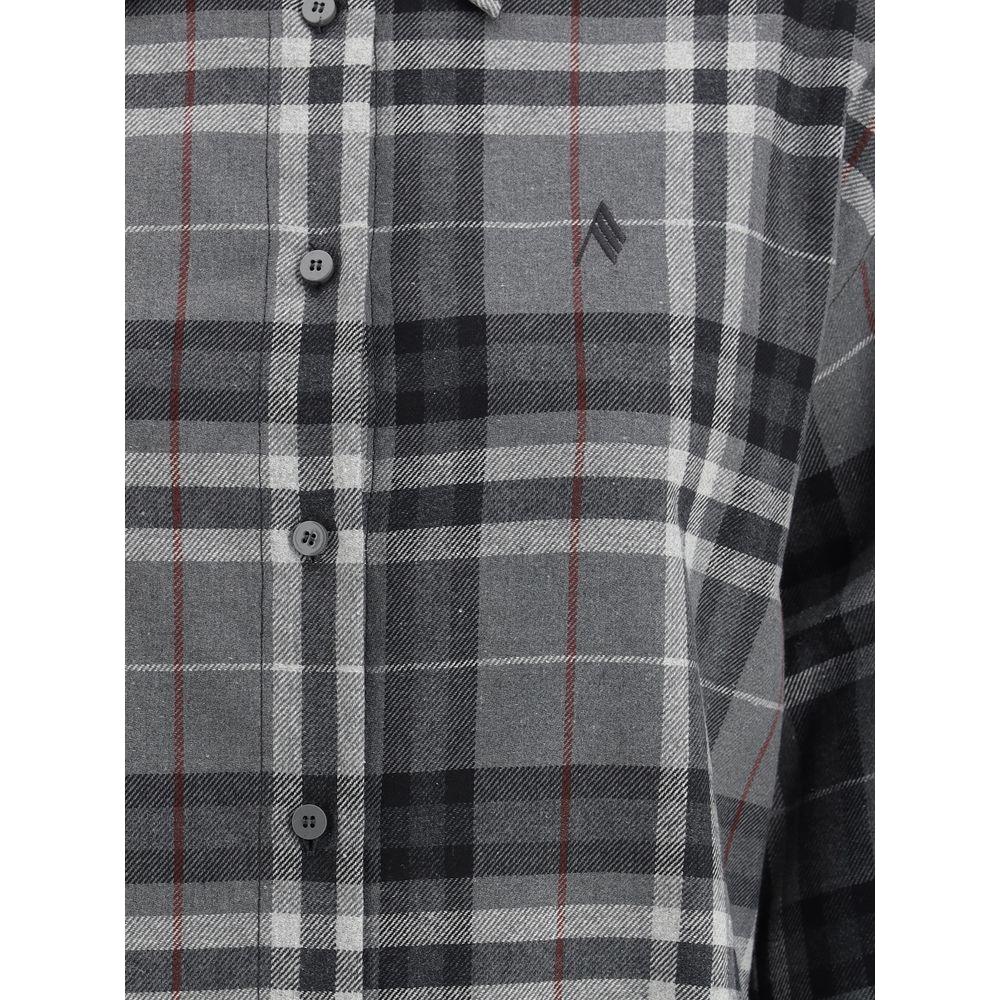 Close-up of The Attico cotton shirt featuring button front, embroidered logo, and check pattern with wide bell sleeves.
