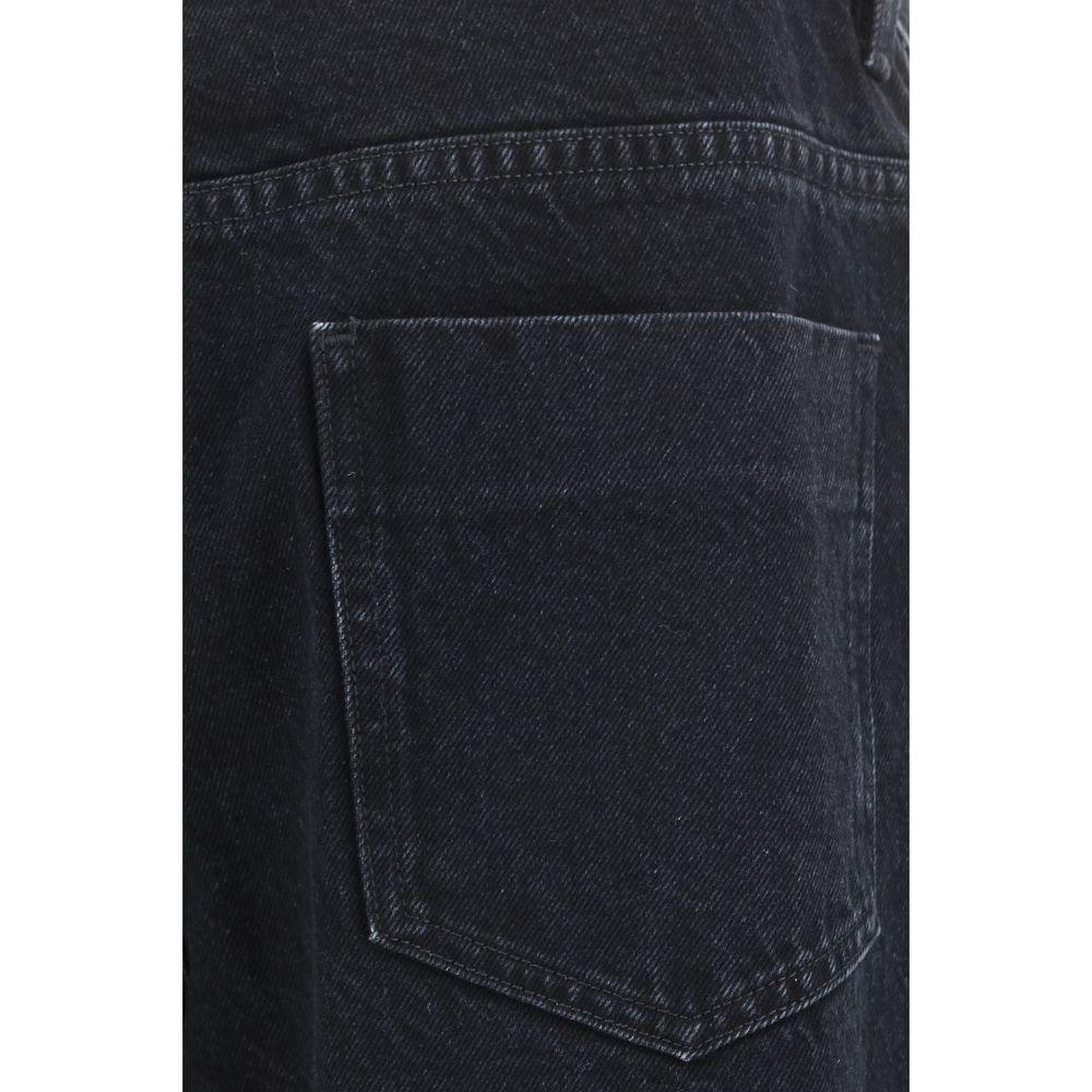 Close-up of Givenchy cotton denim pants pocket, five-pocket straight style with belt loops and signature leather patch on waistband.