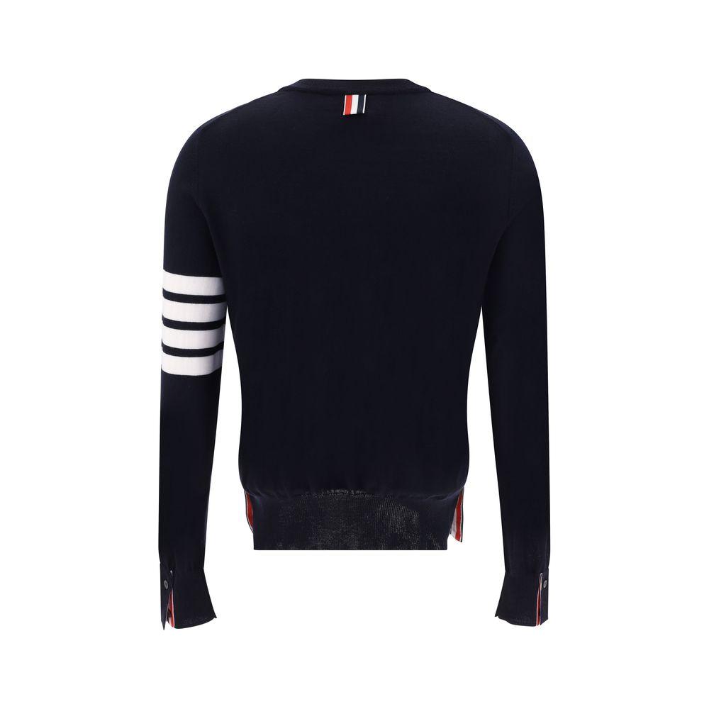 Back view of a Thom Browne fleece wool sweater featuring ribbed crew neck, cuff buttons, side slit buttons, and horizontal stripes on the left arm.