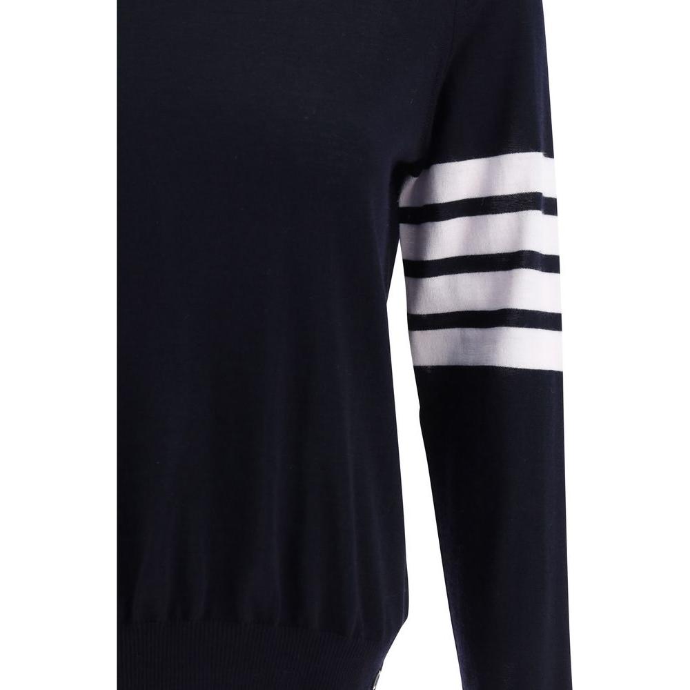 Thom Browne fleece wool sweater with ribbed crew neck and iconic horizontal stripes on the left arm. Slim fit with adjustable hem slits.