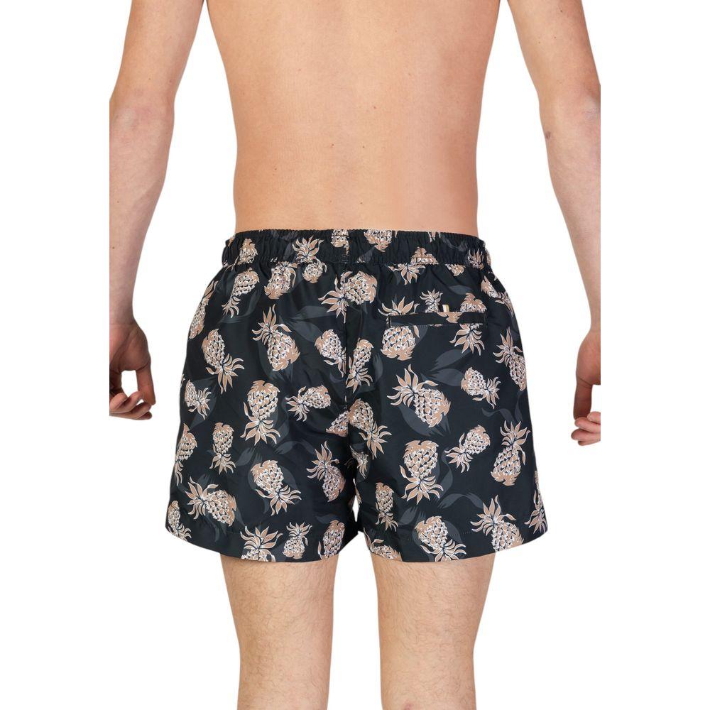 Back view of men's Hugo Boss black swimwear with pineapple print, made from recycled polyester for the Fall/Winter collection.