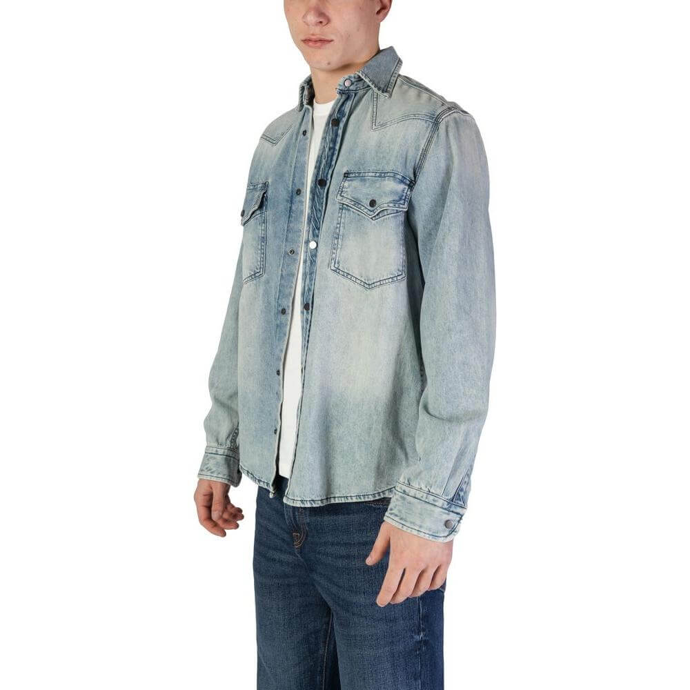 Hugo Boss light blue long sleeve cotton shirt for men, perfect for the fall/winter collection, shown on model.