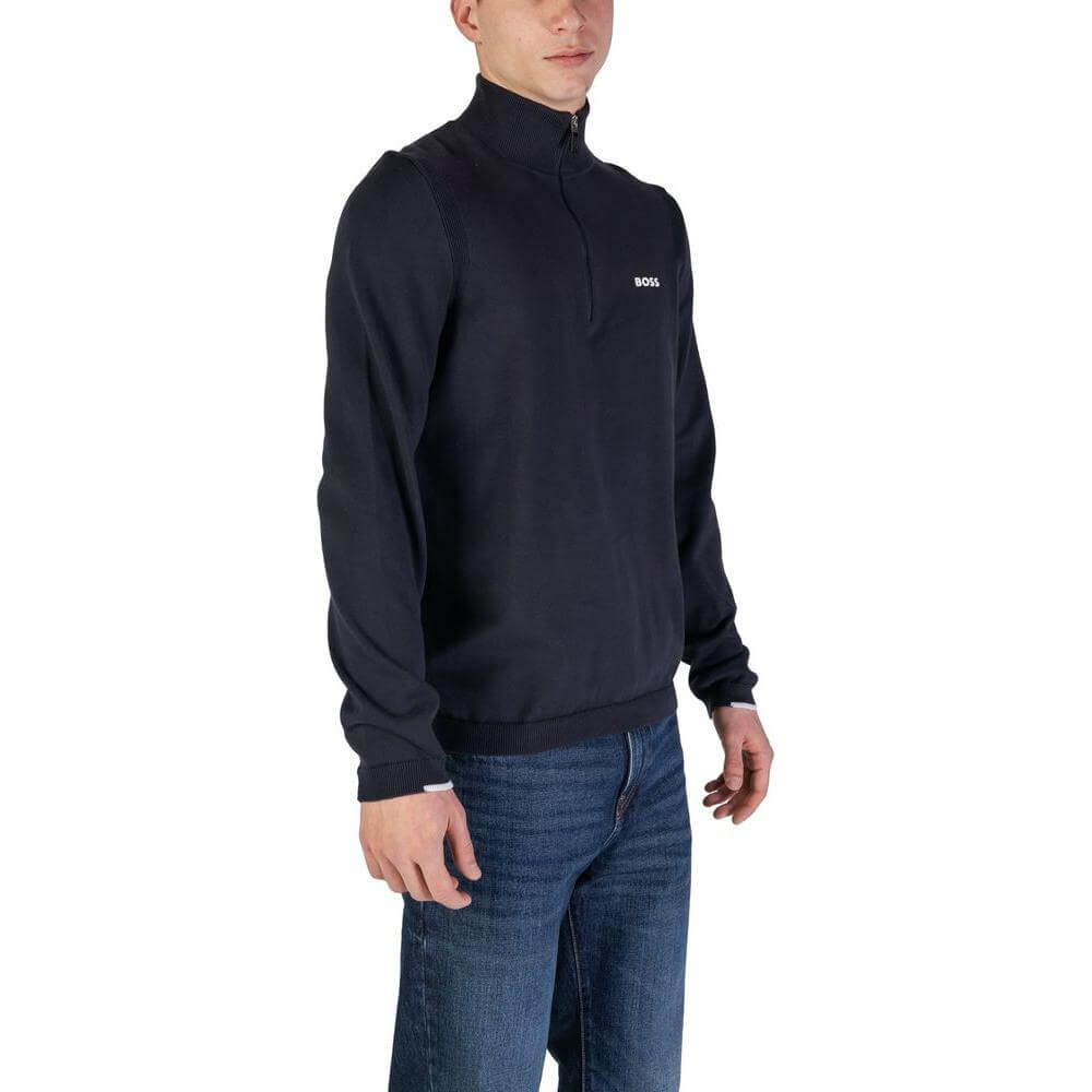 Man wearing a Hugo Boss blue cotton cardigan, part of the men's Fall/Winter collection, made with 89% cotton, polyester, and elastane.