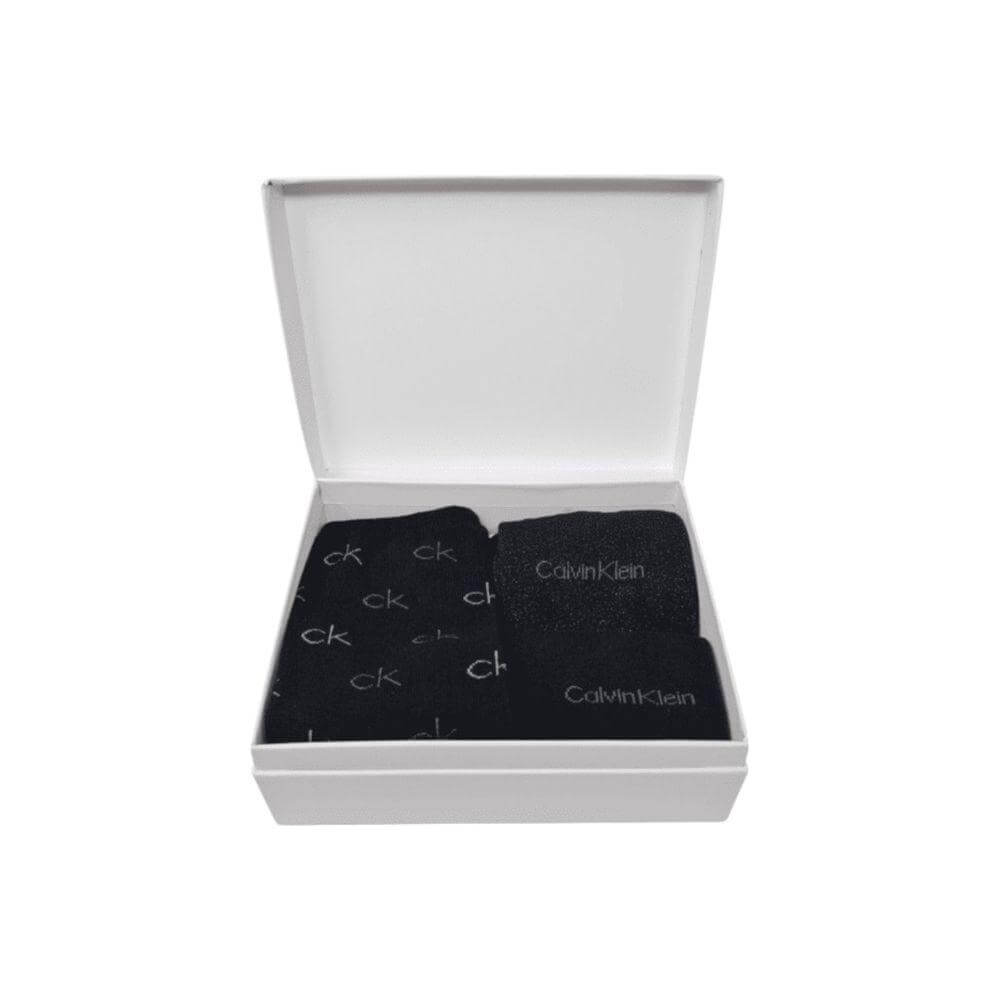 Calvin Klein black cotton tights and socks set in open white box, featuring logo and lurex details.