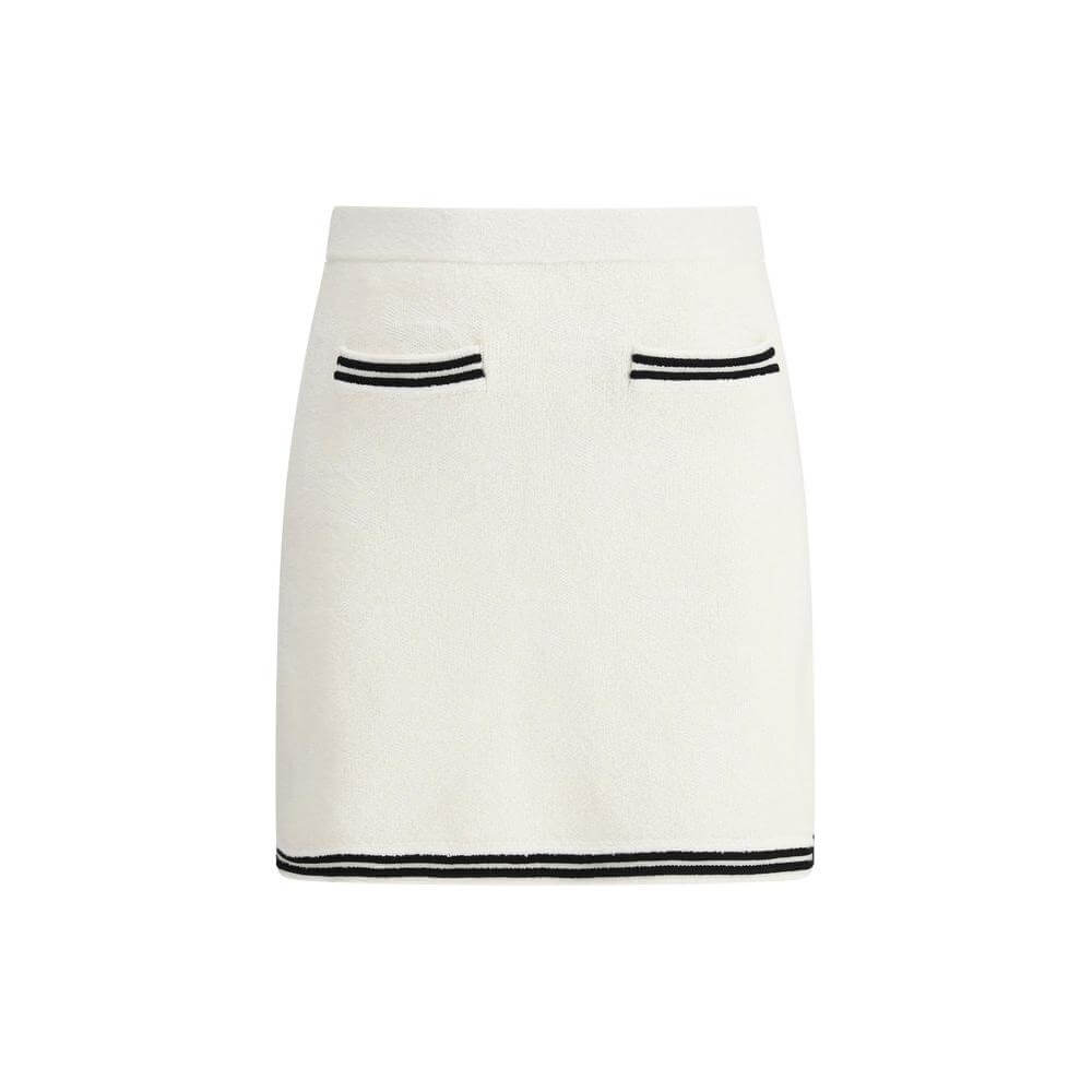 Self-Portrait midi skirt with elastic waistband, jacquard weave, tone-on-tone bows, contrast hemline, and front welt pockets.
