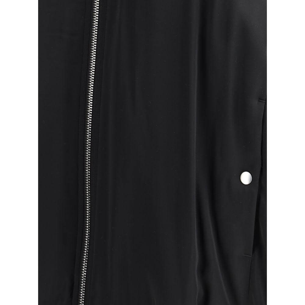 Close-up of Rick Owens bomber jacket showing double-slider zipper and side snap button detailing.