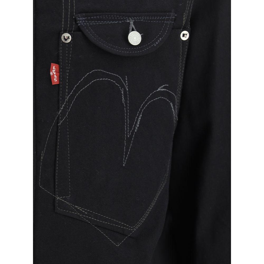 Junya Watanabe x Levis wool shirt close-up showing pocket and stitching details, monochrome pattern, and button closure.
