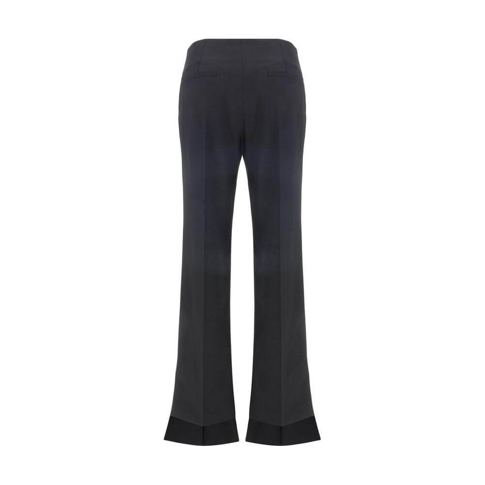 Back view of Chloé Virgin Wool Pants with asymmetrical hems and monochrome pattern, featuring two back welt pockets, regular fit.