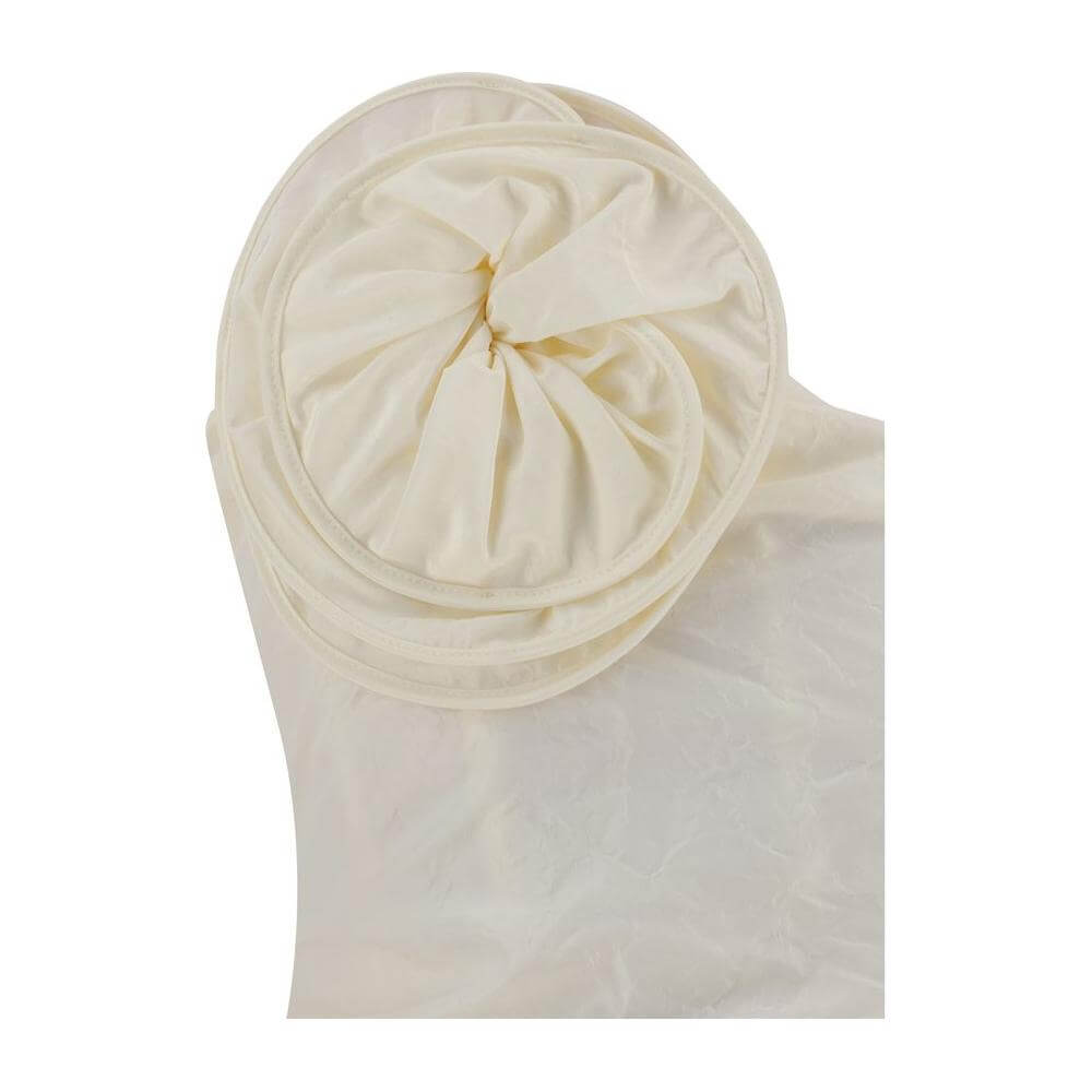 Close-up of three-dimensional maxi flower applique on Magda Butrym Mini Dress. Asymmetrical neckline and ruched silk fabric.