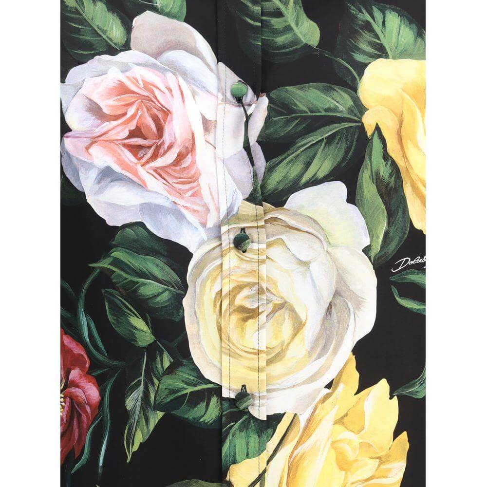 Dolce & Gabbana shirt showcasing a vibrant floral motif with roses and peonies on dark fabric.