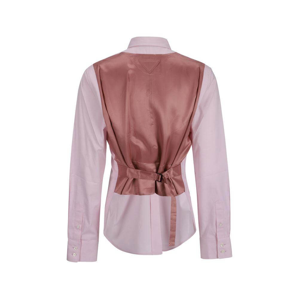 Prada cotton shirt with classic collar, back adjustable martingale strap, and asymmetrical hem, showcasing a chic monochrome design.