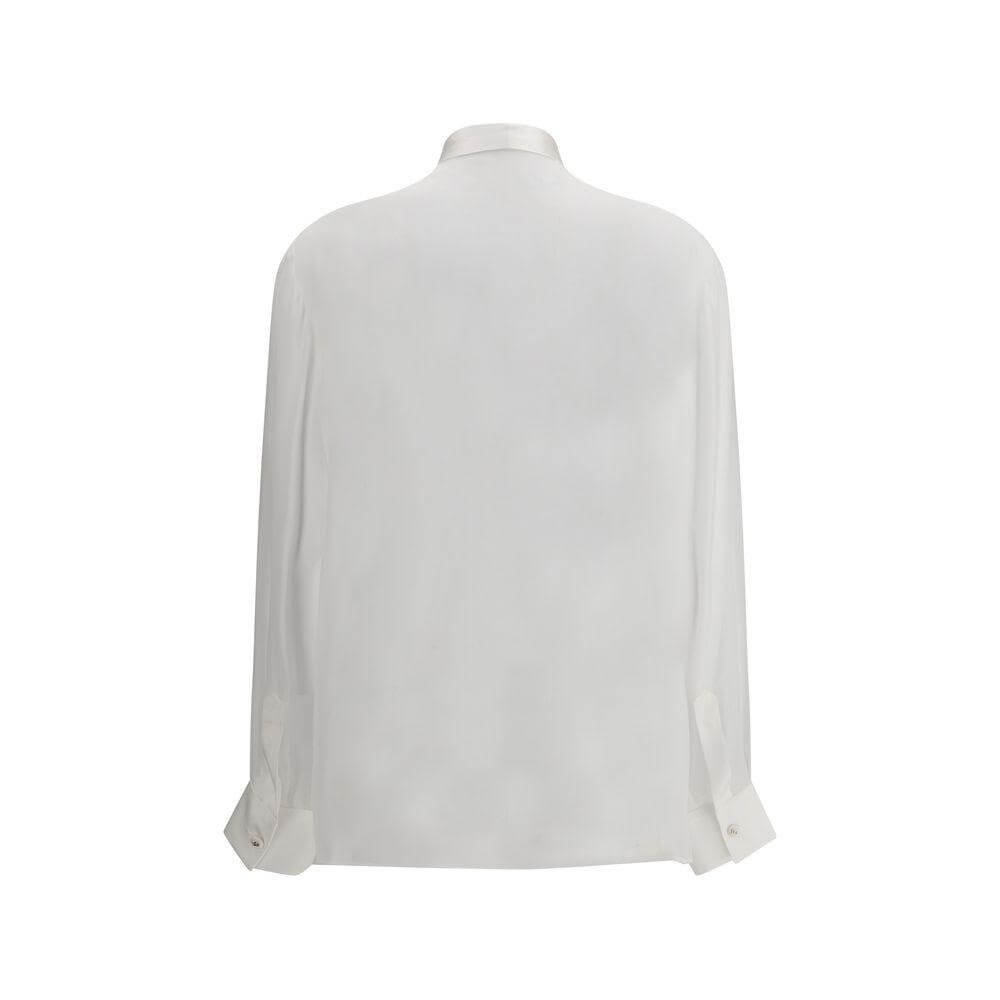 Back view of Dolce & Gabbana silk chiffon shirt in white, featuring a semi-transparent design with elegant cuffs.