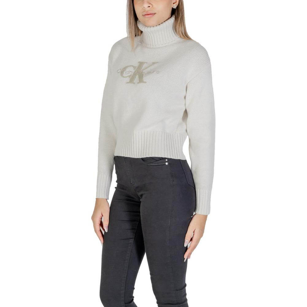 Calvin Klein cream cotton sweater for women, fall/winter collection, knitwear with logo, 60% cotton, 40% acrylic, turtleneck style.