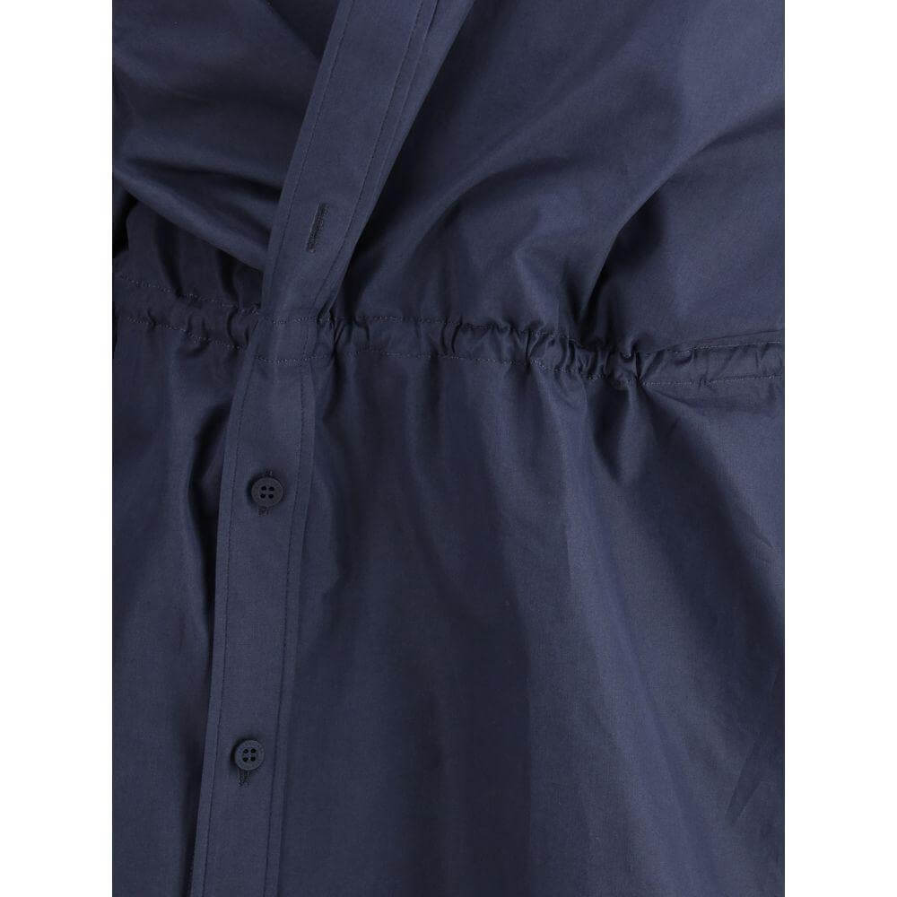 Close-up of Balenciaga Shirt Mini Dress showing asymmetrical button closure and adjustable elastic waistband.