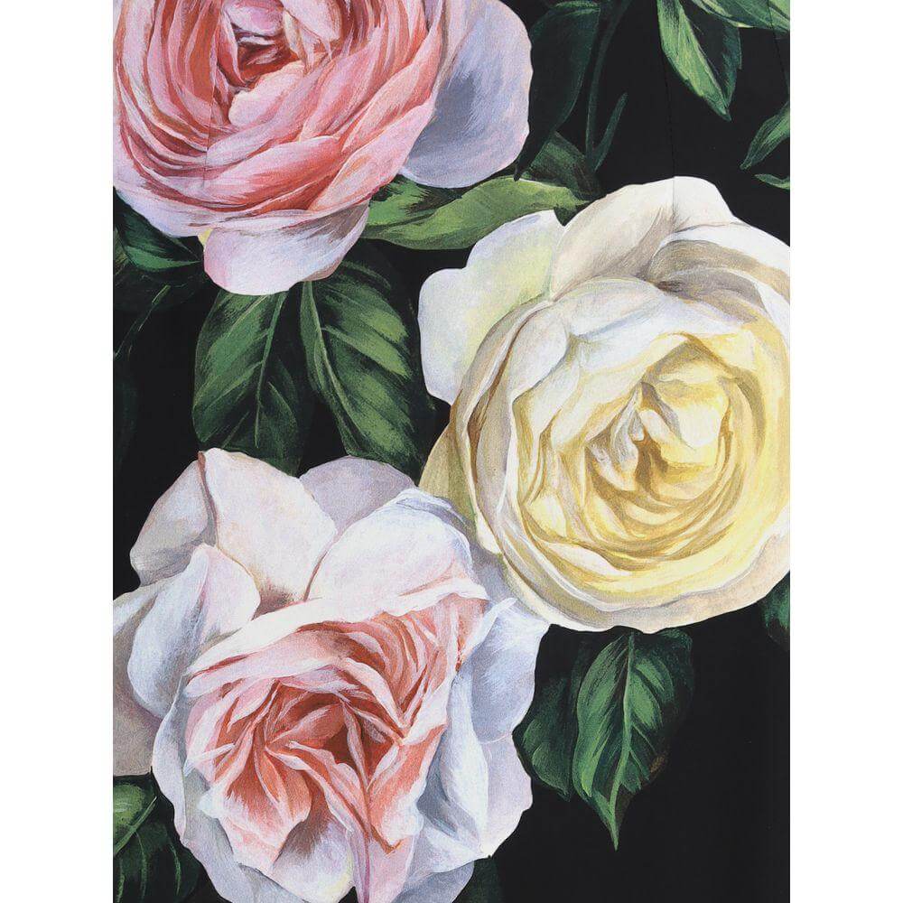 Close-up of Dolce & Gabbana skirt fabric featuring a vibrant rose and peony pattern on a black background.