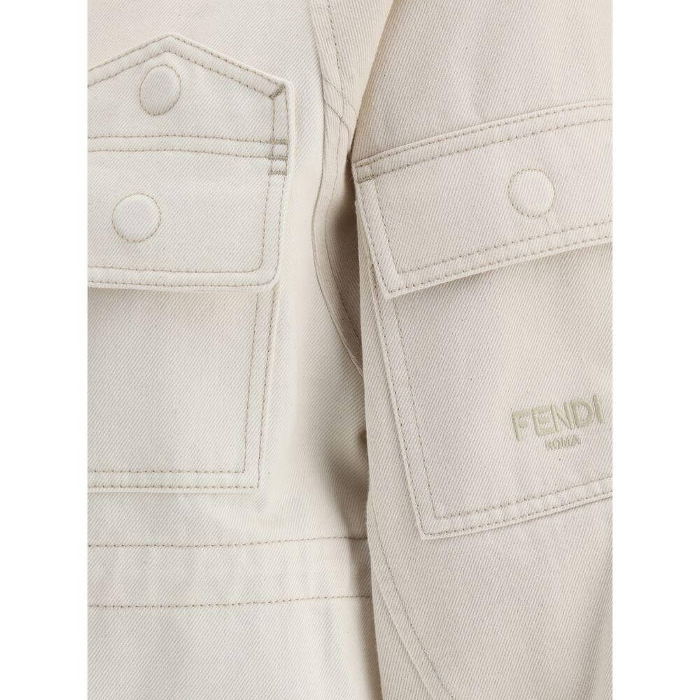 Close-up of Fendi Denim Bomber Jacket showing front patch pockets and Fendi logo on cotton fabric.