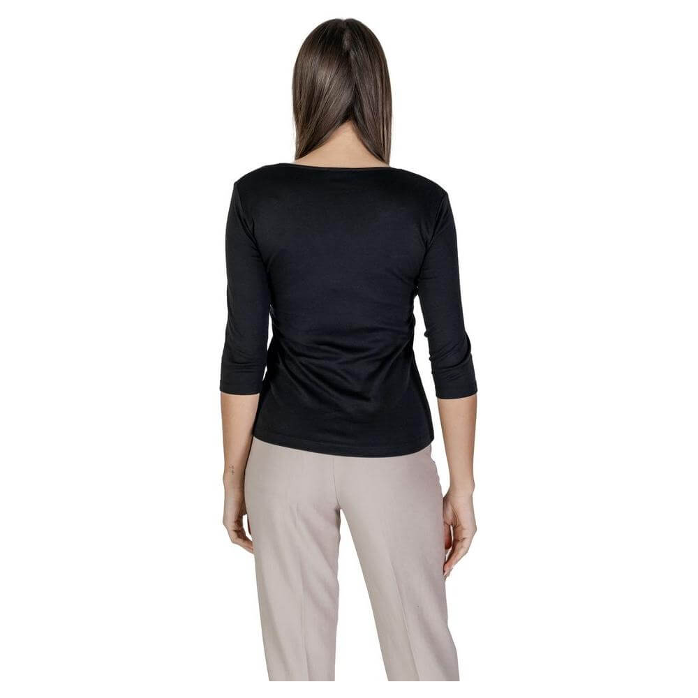 Back view of woman wearing Street One black cotton T-shirt, short sleeves, part of spring/summer collection.