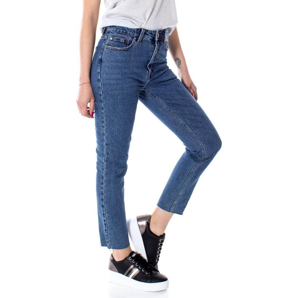 Woman wearing Only Blue Cotton Jeans with high waist and ankle-length cut for a stylish casual look.