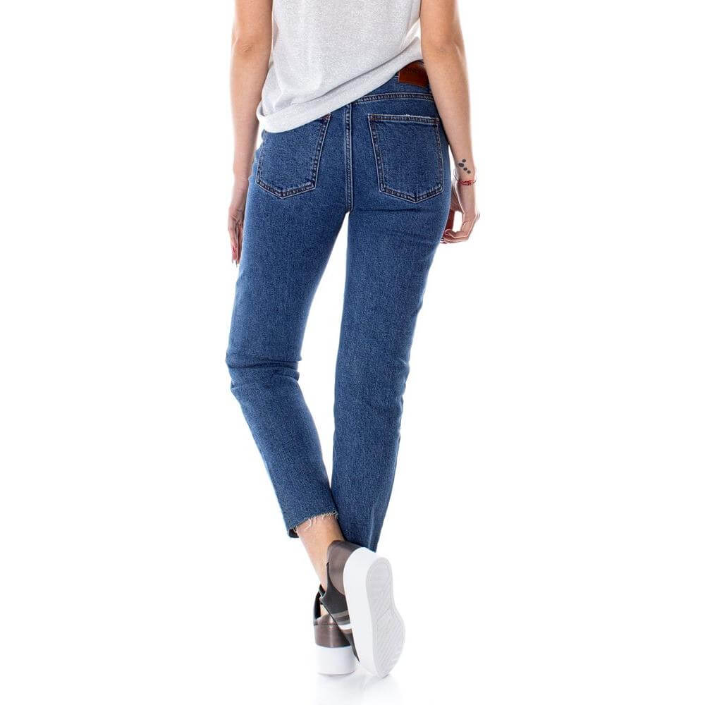 Back view of woman wearing Only Blue high-waist cotton jeans with ankle-length cut, showcasing casual yet stylish design for women.