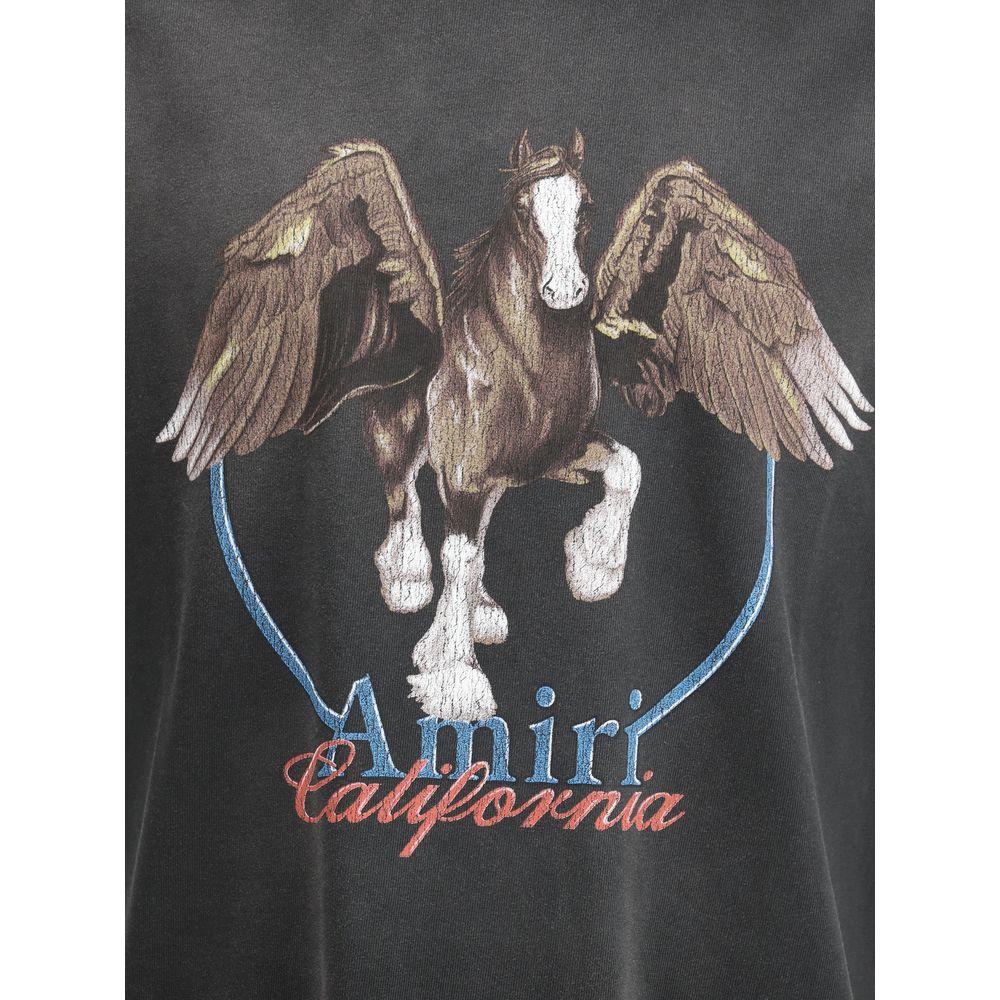 Amiri Pegaso T-Shirt featuring bold Pegasus print with Amiri logo, symbolizing strength and freedom on vintage-style black cotton.