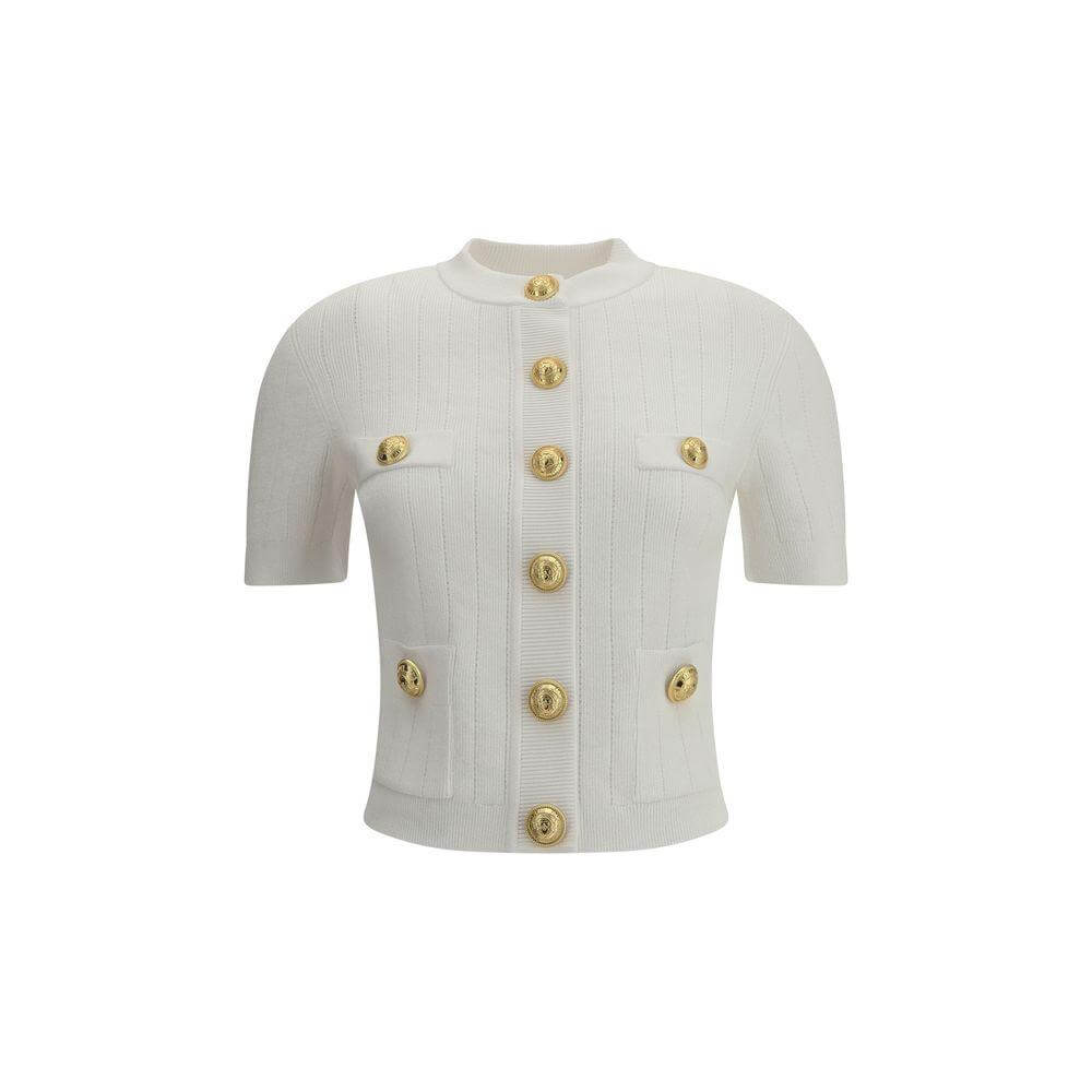 Balmain short-sleeved white cardigan with embossed gold buttons, ribbed crew neck, two buttoned welt pockets, and cropped fit.
