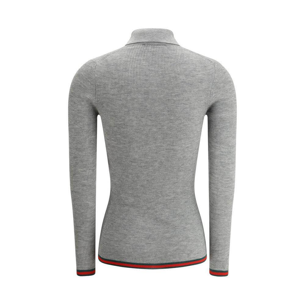 Back view of Gucci Cashmere Polo Shirt featuring ribbed design, classic collar, and iconic colored bands on hem and cuffs.