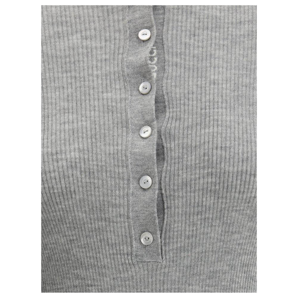 Close-up of Gucci Cashmere Polo Sweater with ribbed design and tone-on-tone buttons, showcasing elegant and sophisticated craftsmanship.