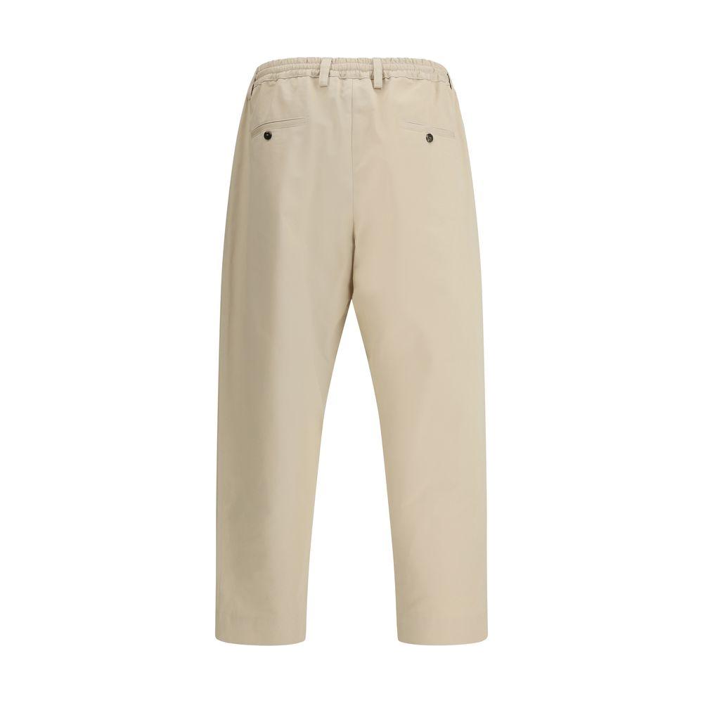 Back view of Marni cropped pants in beige with elastic waistband and slit pockets.