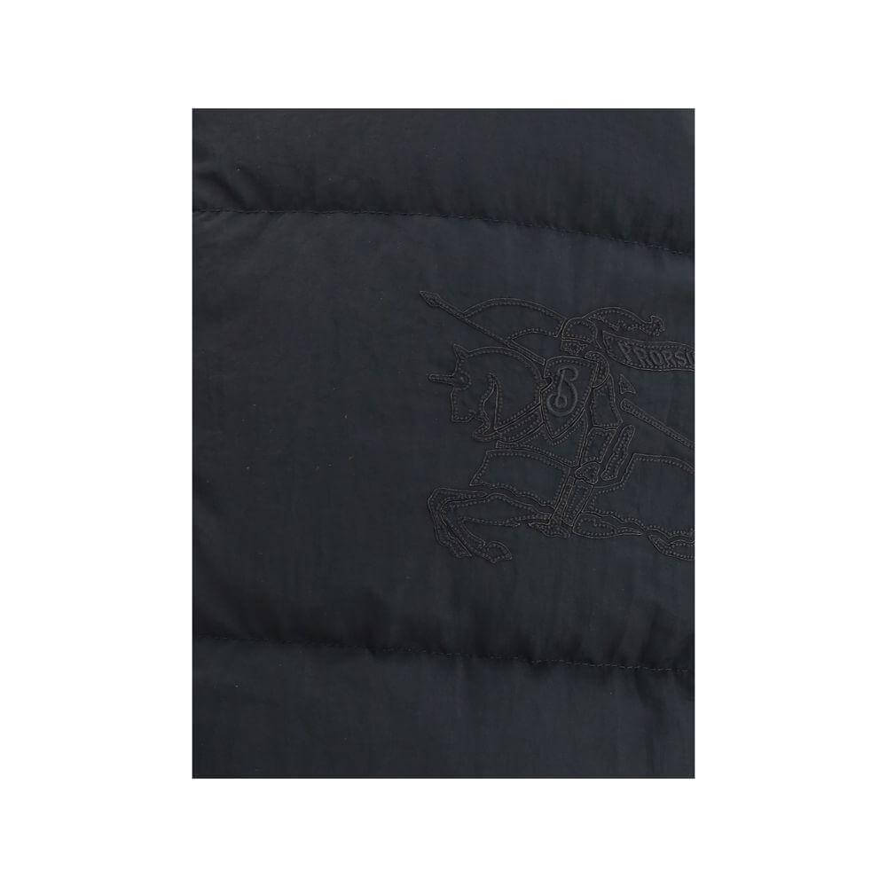 Detailed view of Burberry Reversible Down Vest showcasing the embroidered design on dark fabric.