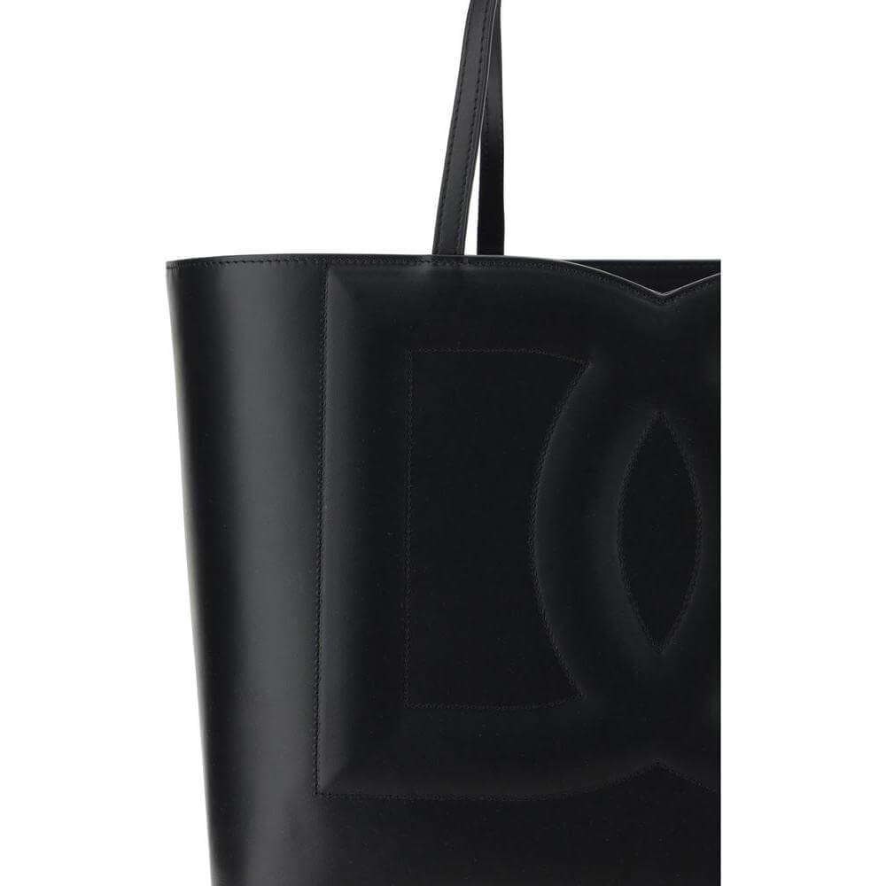 Dolce & Gabbana black calfskin handbag with embossed logo and double handles.