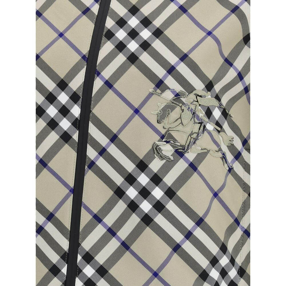 Close-up of a Burberry reversible jacket featuring the iconic Check Archivio pattern with embroidered detail.
