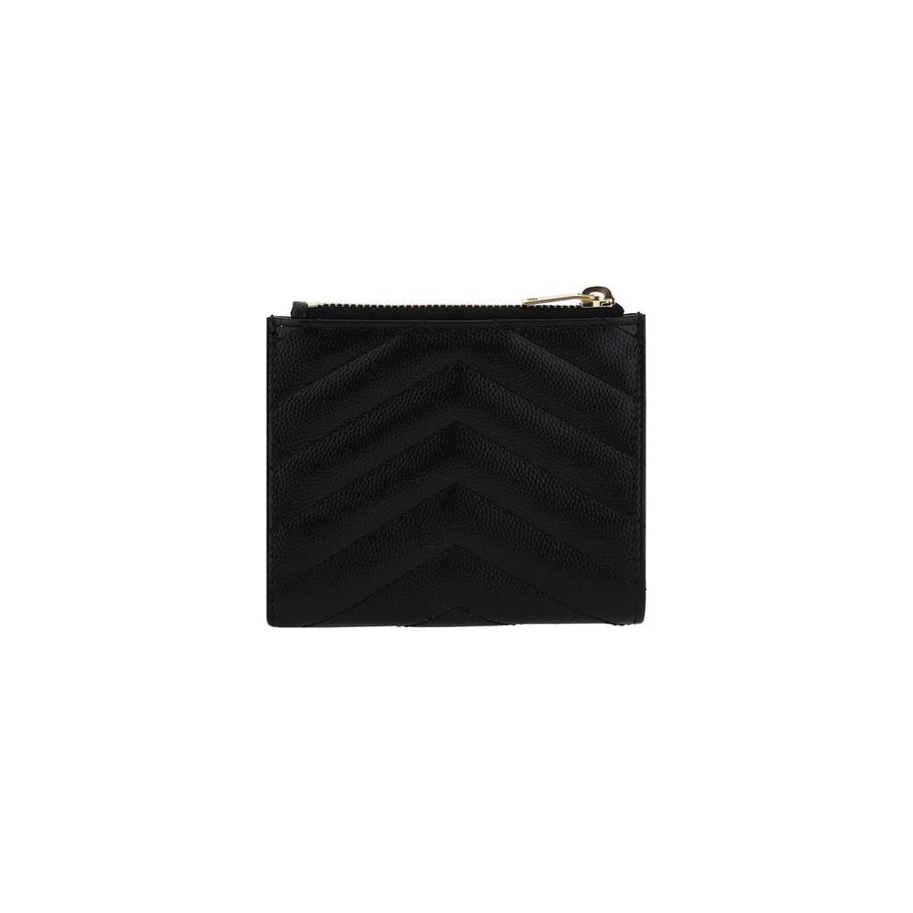 Saint Laurent calfskin wallet with matelassé design, embossed monogram, snap-button closure, card slot, bill compartment, and zippered pocket.