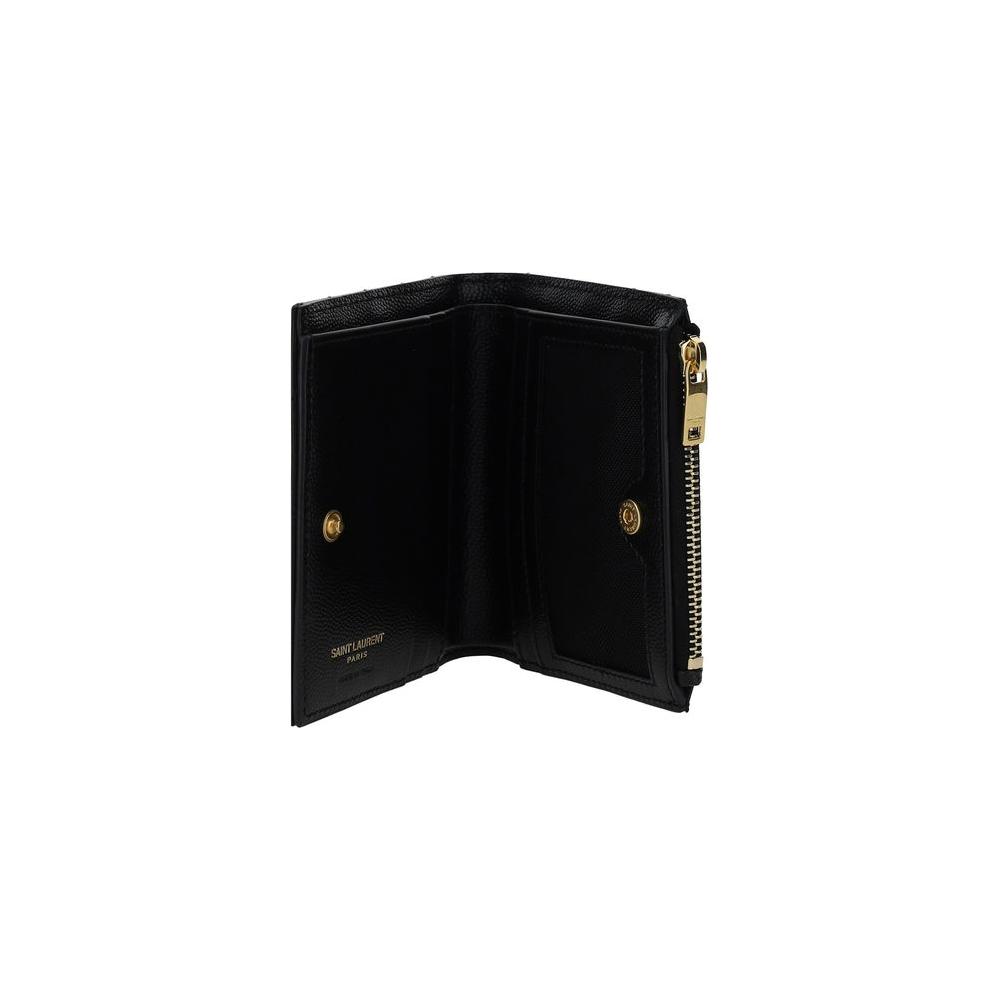 Saint Laurent calfskin wallet with matelassé design, iconic embossed monogram, snap-button closure, card slot, and zippered pocket.