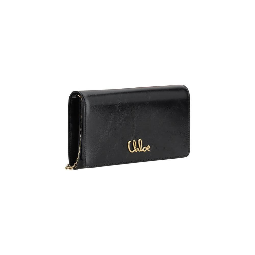 Chloé Iconic Pochette in black leather with gold logo and removable chain strap, versatile clutch and shoulder bag for elegant style.