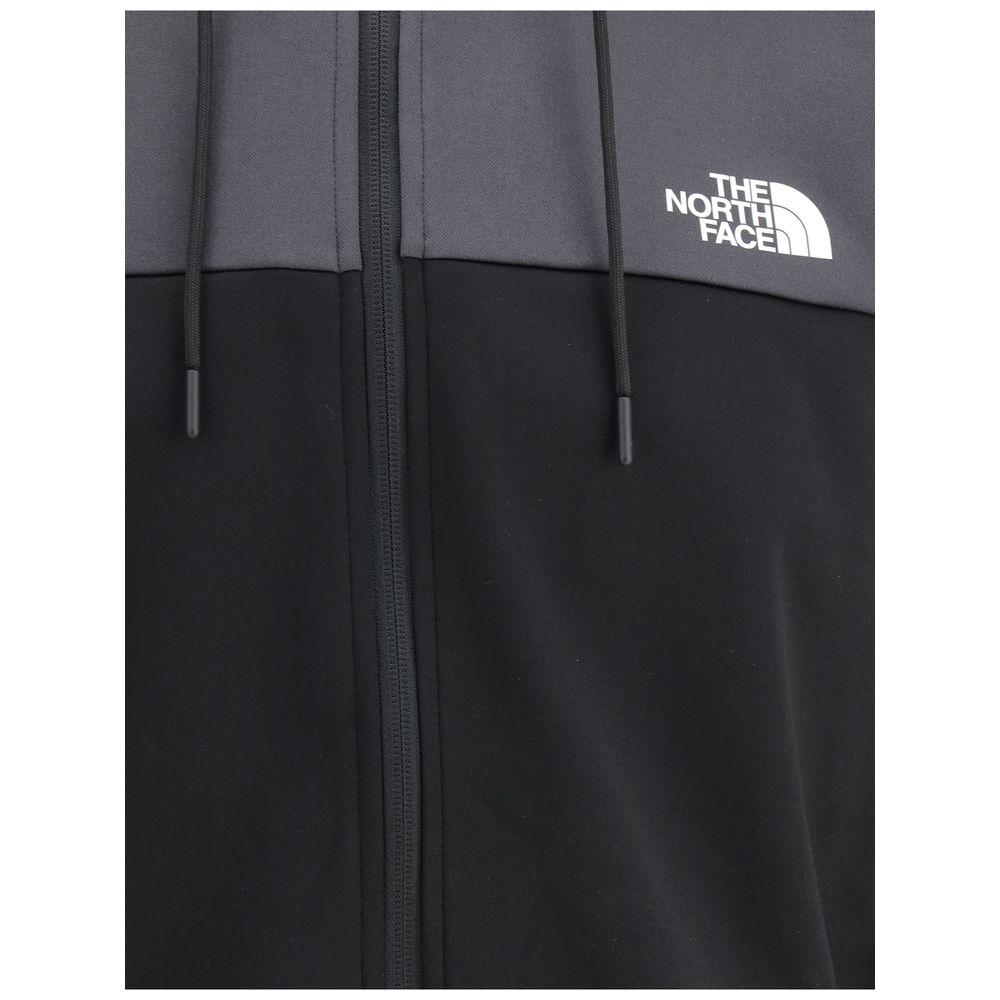 The North Face Reaxion Fleece Hoodie with logo, adjustable hood, zip closure, and pockets, ideal for outdoor activities and casual wear.