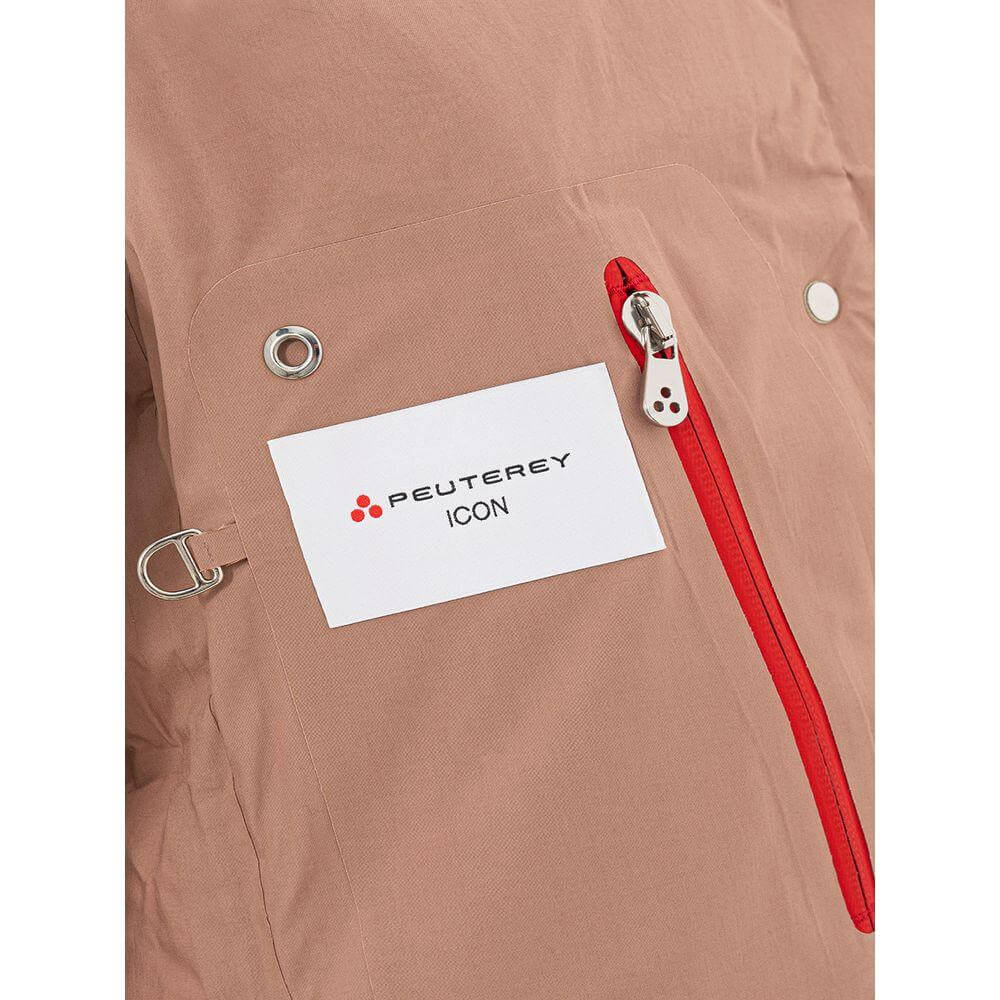 Close-up of Peuterey pink cotton jacket with red zipper and logo label, featuring black snap button and metal loop detail.