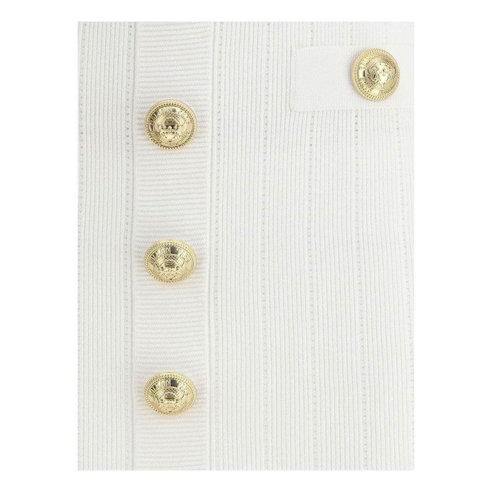 Balmain Mini Skirt with ribbed design and gold lion's head buttons.