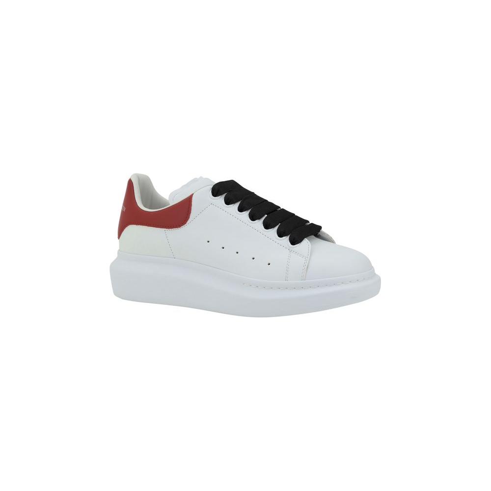 Alexander McQueen leather sneakers with lace-up closure and logoed heel, featuring a platform sole.