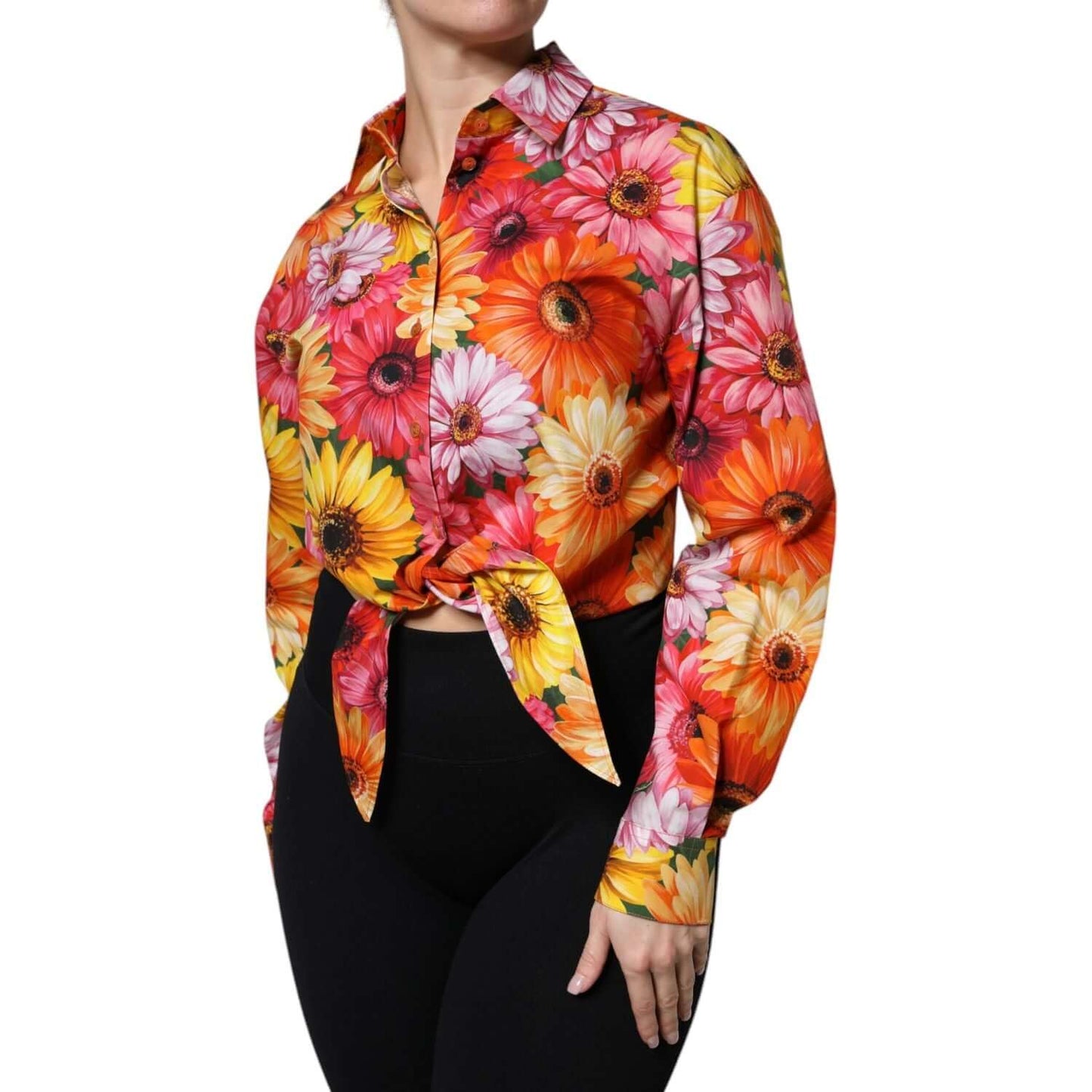 Dolce & Gabbana multicolor floral cotton cropped blouse with button down closure and long sleeves, worn by model, exclusive Italian design.