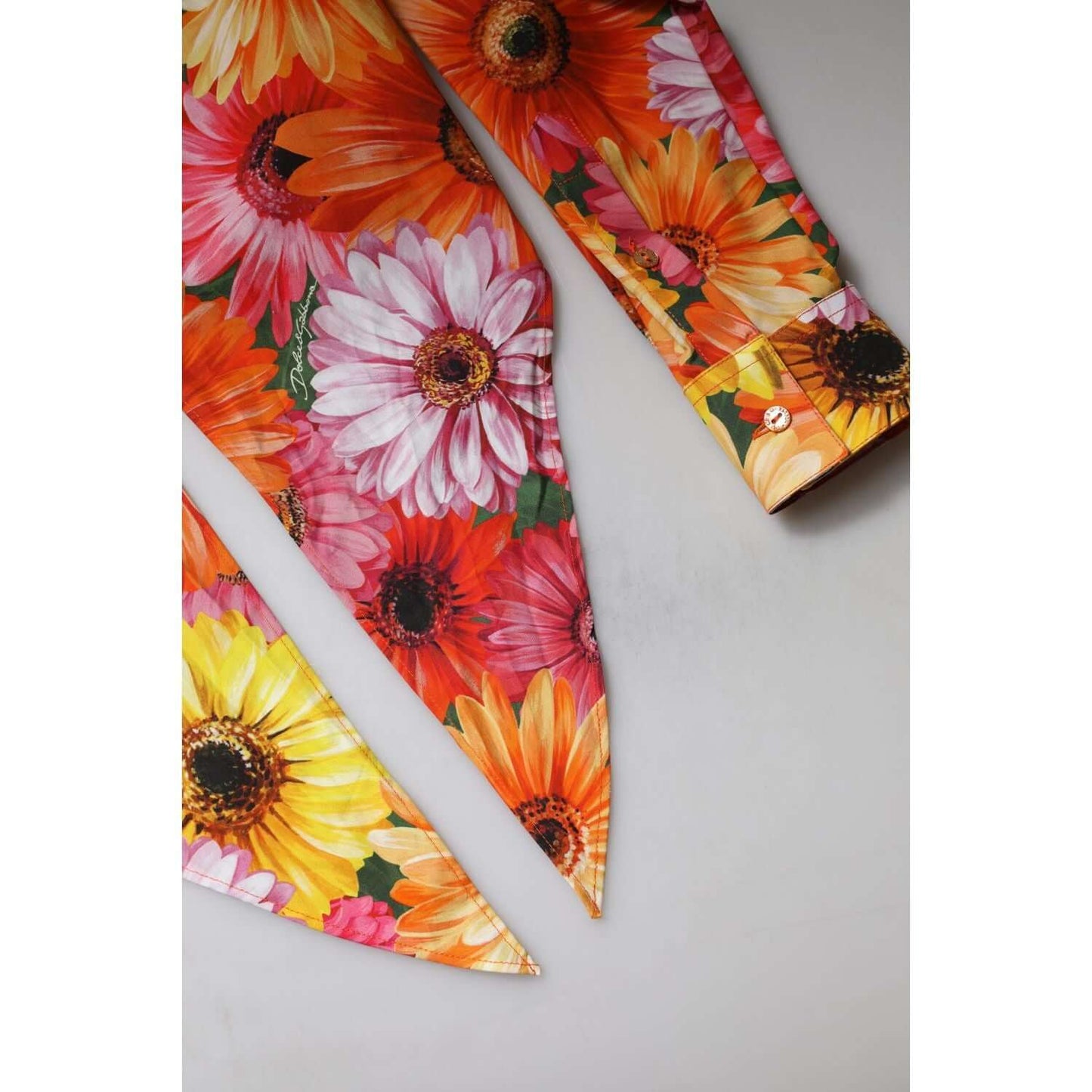 Dolce & Gabbana multicolor floral cotton cropped blouse with long sleeves and button detail, made in Italy.