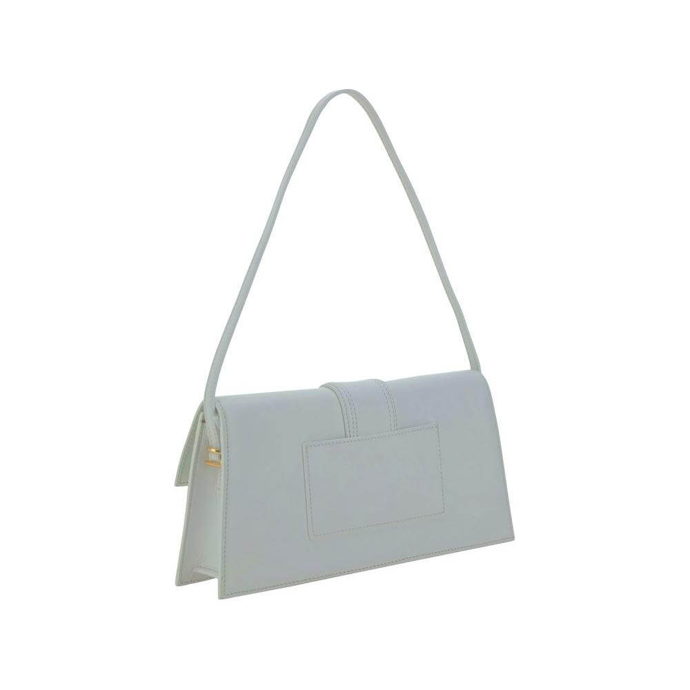 Jacquemus Le Bambino Long Shoulder Bag in white with flat top handle and adjustable strap, featuring a geometric design and monogram plaque.