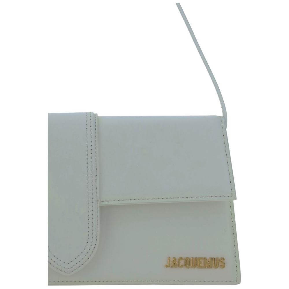 Jacquemus Le Bambino Long Shoulder Bag in white with monogram plaque, featuring flat top handle and adjustable strap for versatile styling.