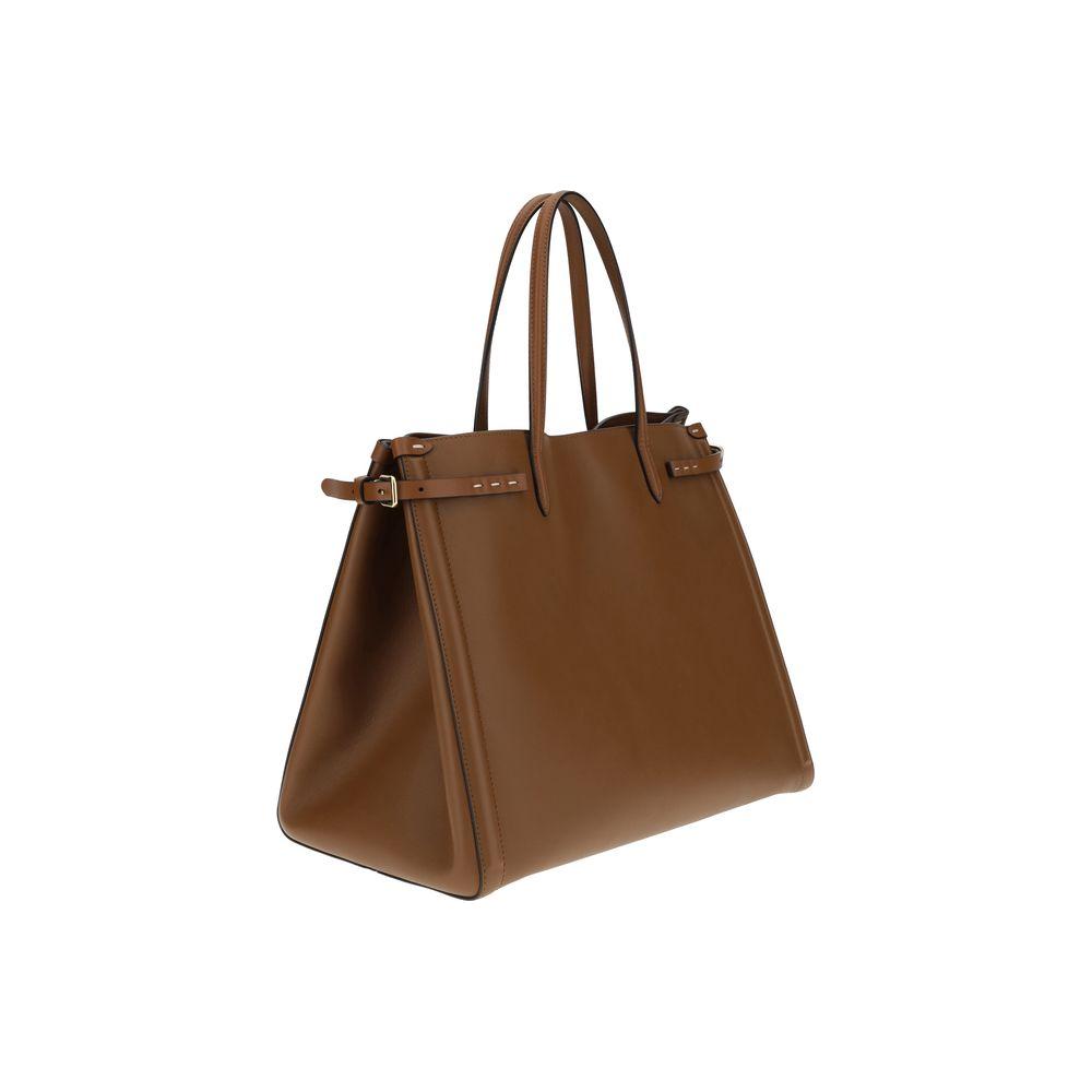 Valentino Garavani Antibes Handbag with gold metallic details and leather patch, side buckles, and protective feet in a brown finish.