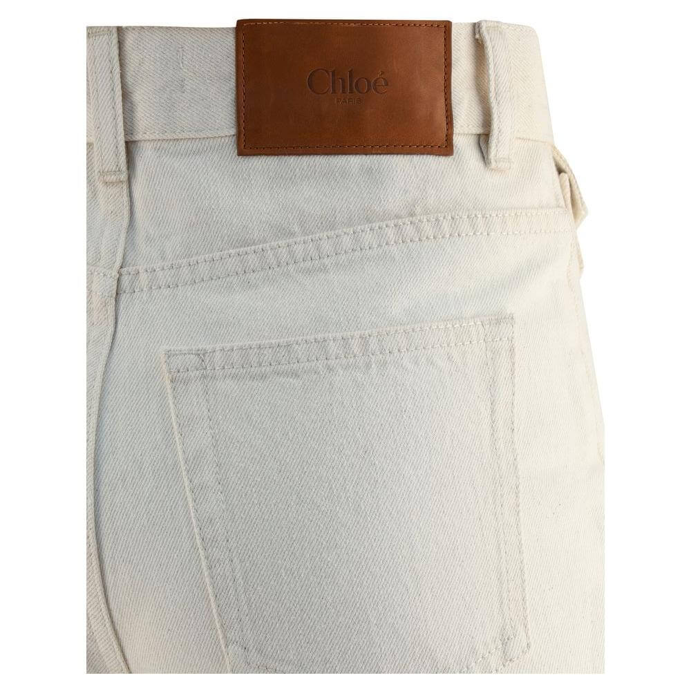 Chloé jeans showcasing back patch pocket and leather brand label, illustrating modern design and sleek fit.
