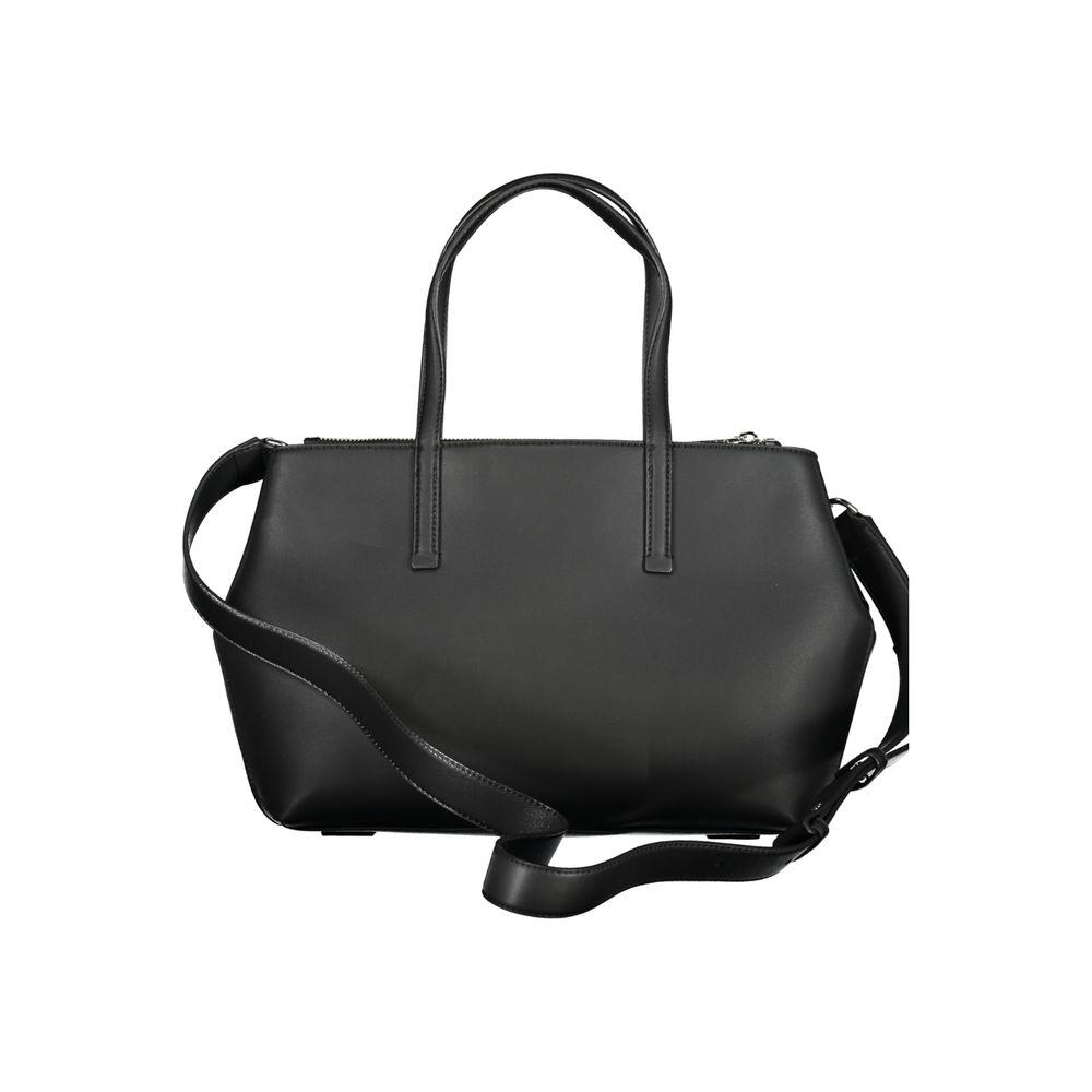 Calvin Klein black polyester handbag with two handles and adjustable strap, featuring external and internal pockets.