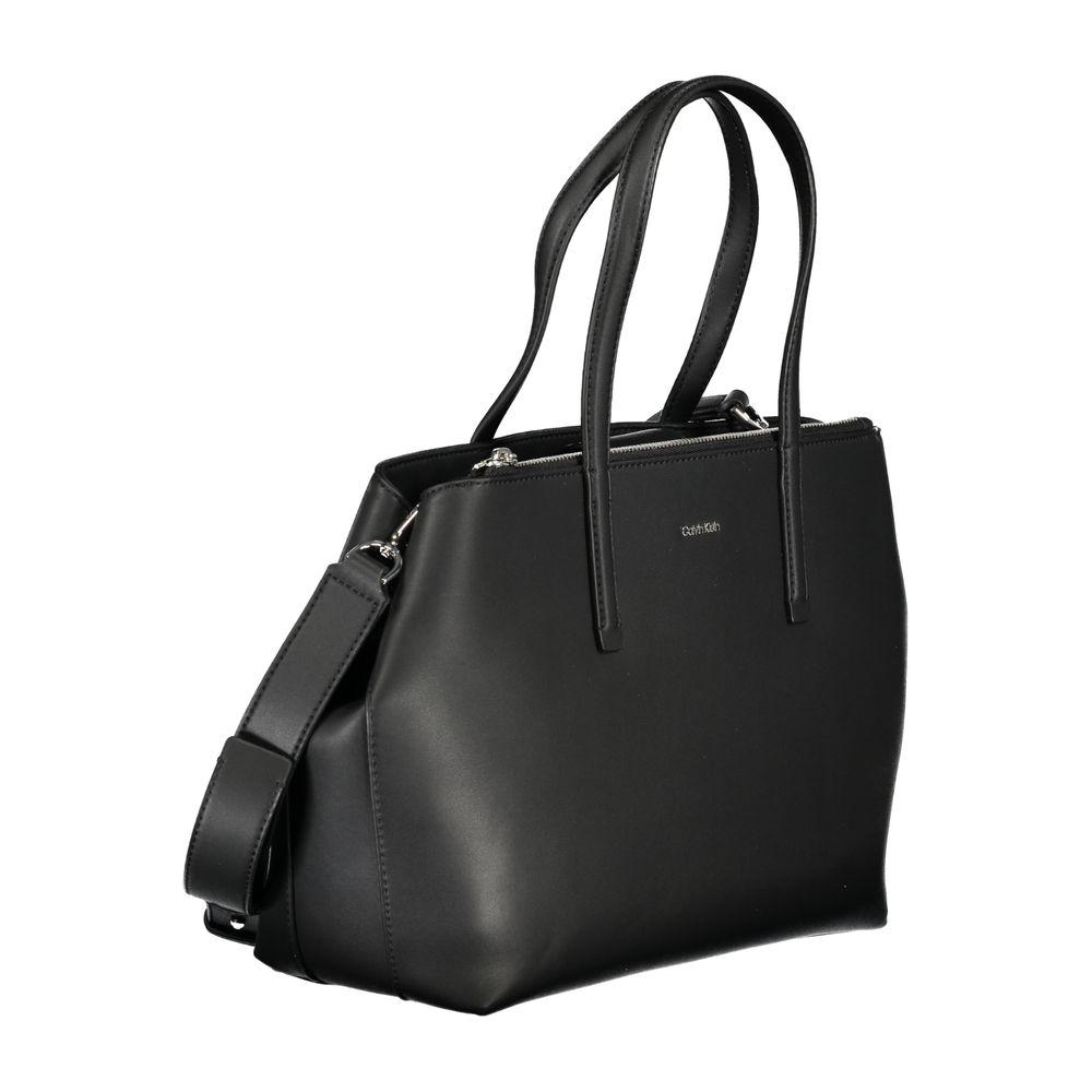 Calvin Klein black polyester handbag with two handles, adjustable and removable strap, featuring external pocket and logo.