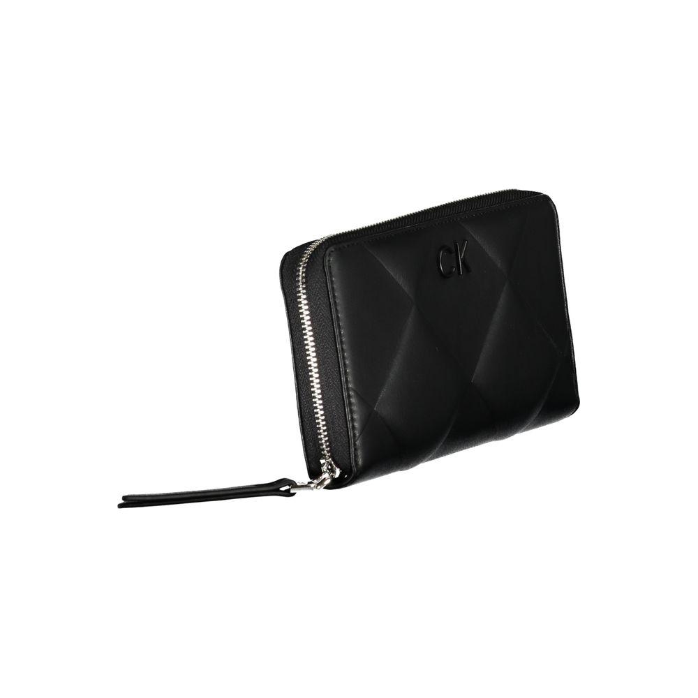 Calvin Klein black wallet with zip closure, 5 compartments, and RFID blocking, featuring a quilted design and CK logo.