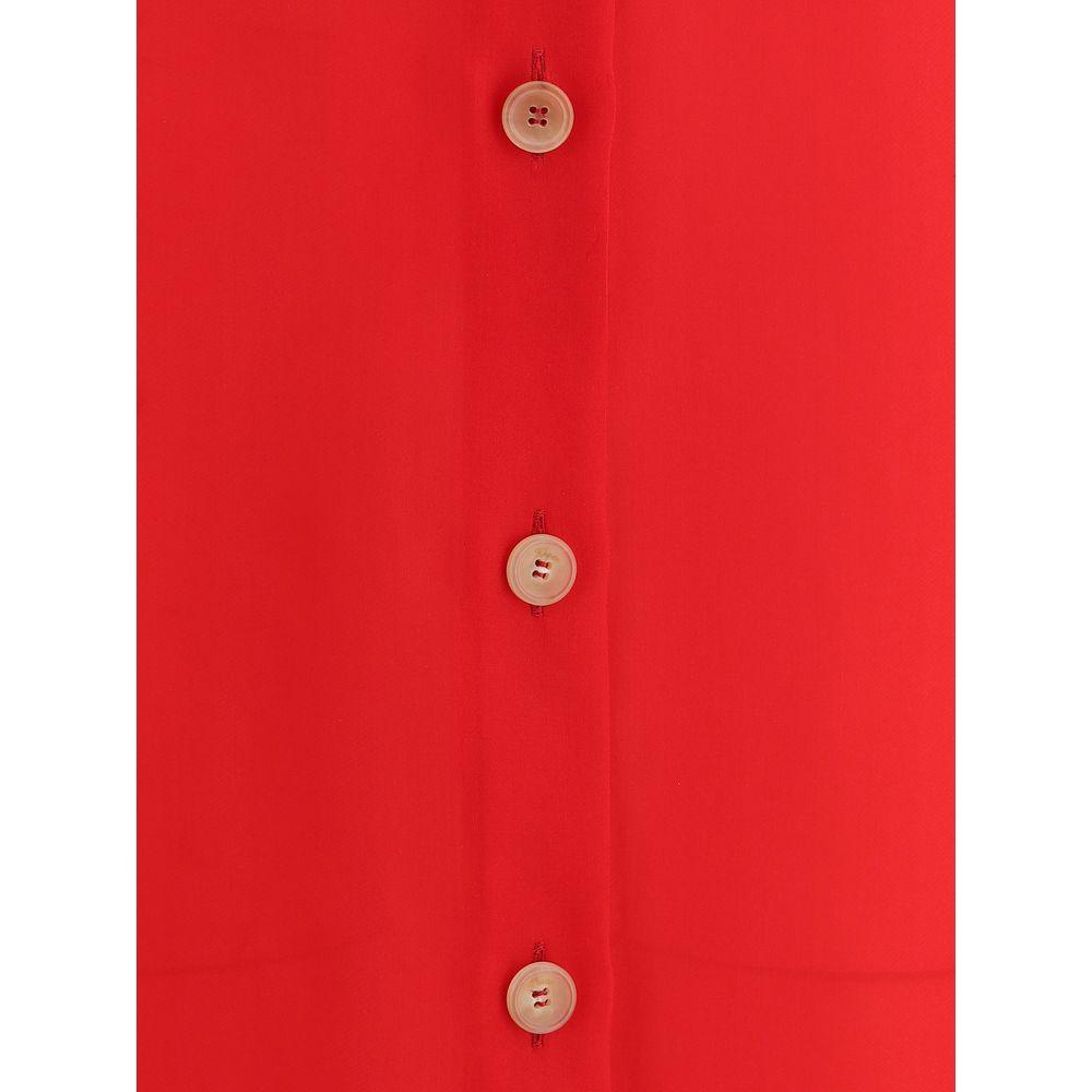 Close-up of Khaite Effy Dress with button details in vibrant red silk.