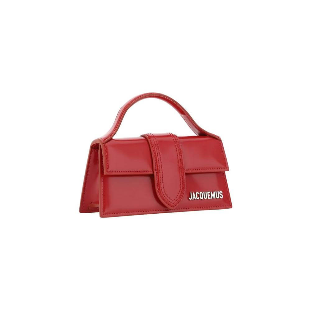 Jacquemus Le Bambino red handbag with flat top handle and adjustable shoulder strap, featuring iconic monogram on the front.