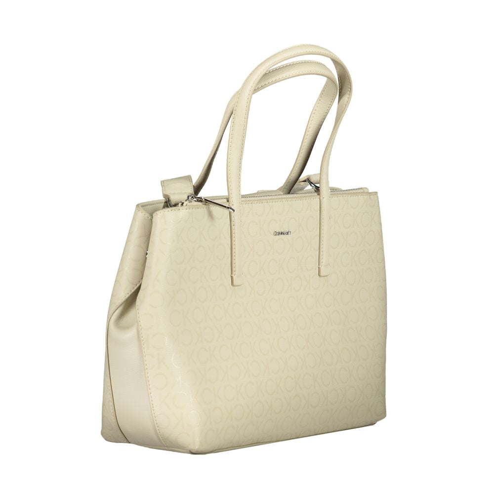 Calvin Klein beige polyester handbag with two handles, adjustable strap, external pocket, and logo design.